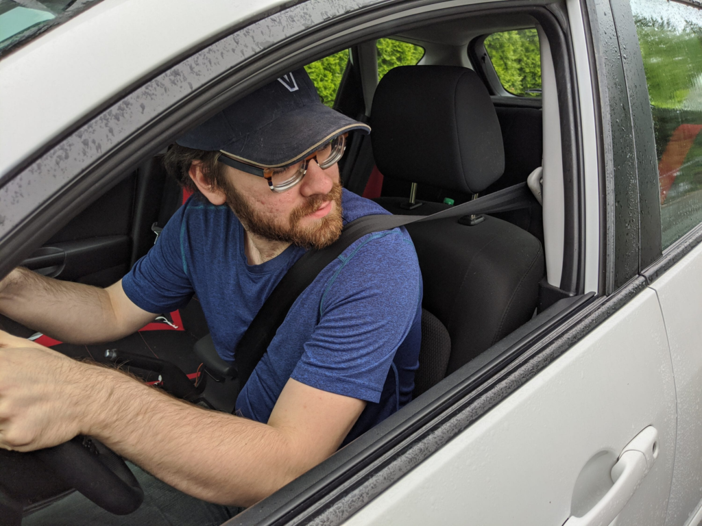 Man checking car's blind spot.